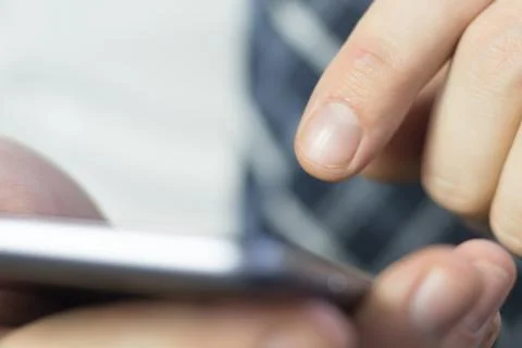 A man uses a smartphone. Фото
