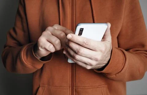 Man uses smartphone Stock Photos