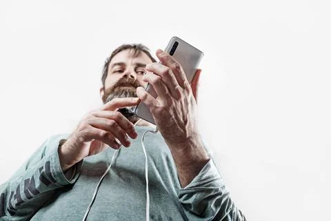 Man uses smartphone Stock Photos
