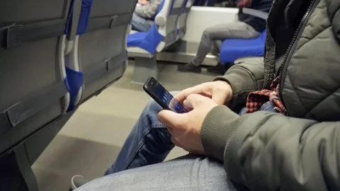 A man uses a smartphone in a train. Available internet signal Vídeo Stock 117751827