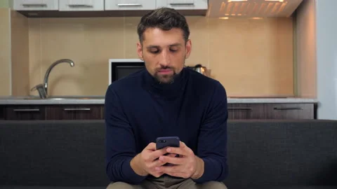 Man uses smartphone typing message in messenger, writing post on social networks Stock Footage 137217801