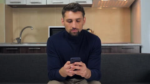 Man uses smartphone typing message in messenger, writing post on social networks Stock Footage 137318042