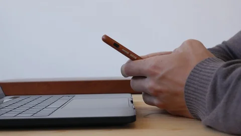 Man uses a smartphone, writes a message, chatting, looking for information in Stock-Footage 128050868