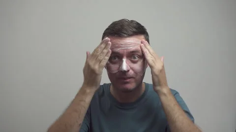 Man uses soap foam for face skin. Personal hygiene Stock Footage 318525729