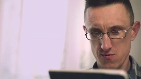 A man uses a tablet. Stock Footage 74053978