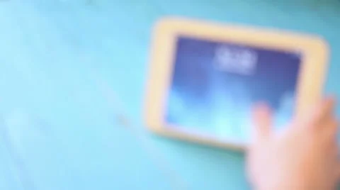 Man uses tablet. strong blur. close-up Stock Footage 60802623