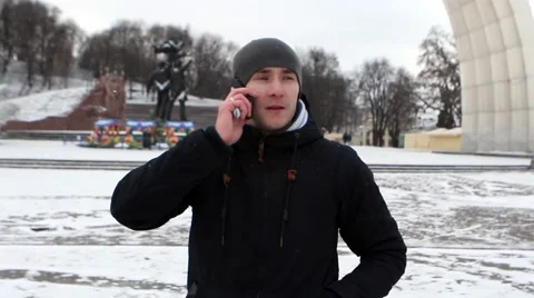 A man uses a Telephone winter Stock Footage 59909987