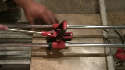 Man Uses Tile Cutting Tool Video stock 12598693