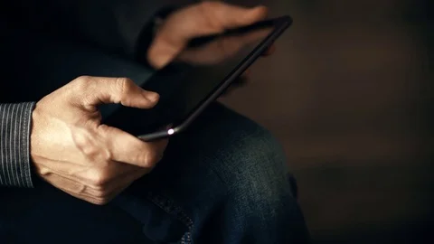A man uses a touchscreen smartphone. Video stock 70381195