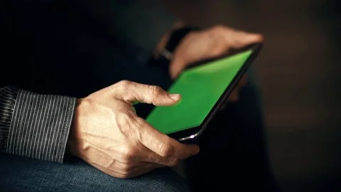 A man uses a touchscreen smartphone. Video stock 70381499