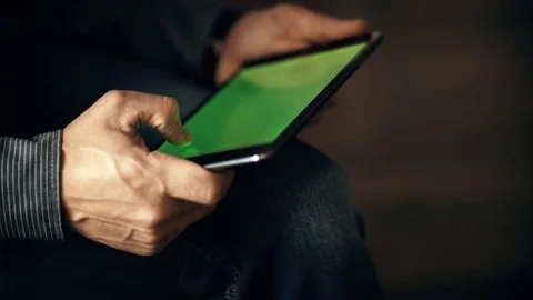 A man uses a touchscreen smartphone. Video stock 70381675
