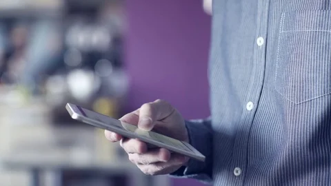 A man uses a touchscreen smartphone. Video stock 70381709