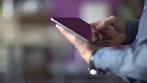 A man uses a touchscreen smartphone. Video stock 70387658
