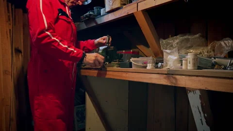 A man uses a vice in a workshop. Stock Footage 318588135