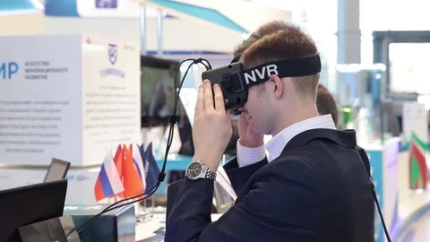 Man uses virtual reality game development kit (virtual reality glasses) Stock Footage 80897898