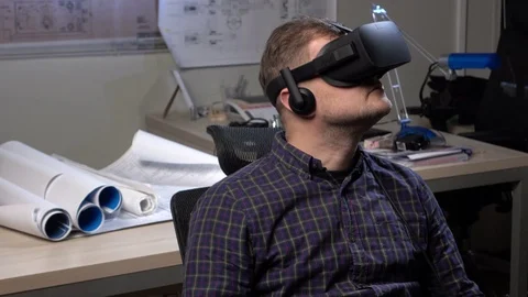 Man uses a virtual reality glasses in the office. Stock Footage 69880127