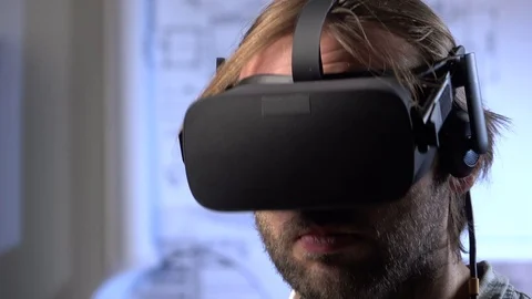 Man uses a virtual reality glasses in the office. Stock Footage 69880270