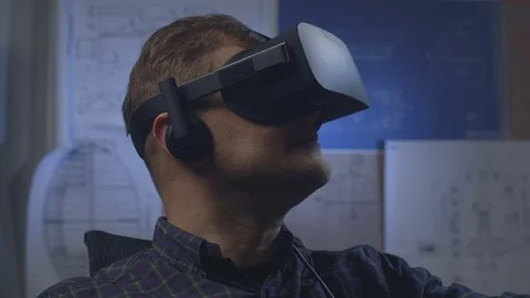 Man uses a virtual reality glasses in the office. Stock Footage 69880320