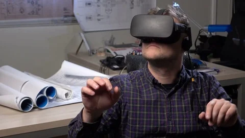 Man uses a virtual reality glasses in the office. Stock Footage 69880332