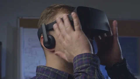 Man uses a virtual reality glasses in the office. Stock Footage 69880614