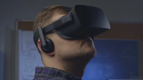 Man uses a virtual reality glasses in the office. Stock Footage 69880700