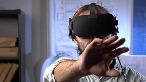 Man uses a virtual reality glasses in the office. Stock Footage 69881091