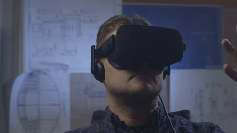Man uses a virtual reality glasses in the office. Stock Footage 69881354