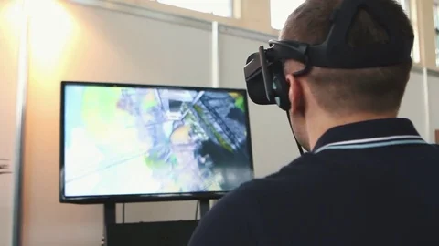 Man uses virtual reality glasses, the image on the monitor Stock Footage 82021319
