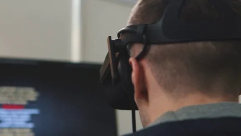 Man uses virtual reality glasses, the image on the monitor Stock Footage 82021371
