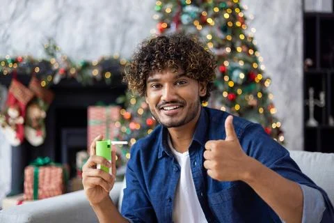 A man uses virtual reality glasses for an online video call and remote Stock Photos