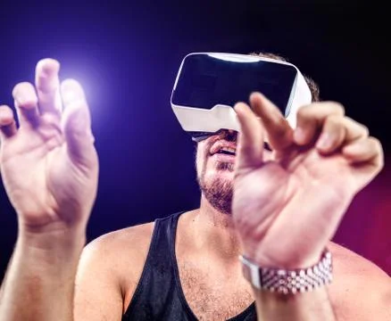 Man uses Virtual Reality VR head-mounted display with fun Stock Photos