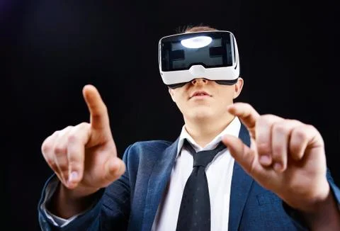 Man uses Virtual Reality VR head-mounted display with fun Stock Photos