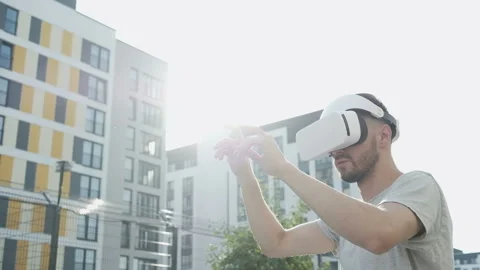 Man uses VR-headset display for virtual reality game. Stock Footage 94061023
