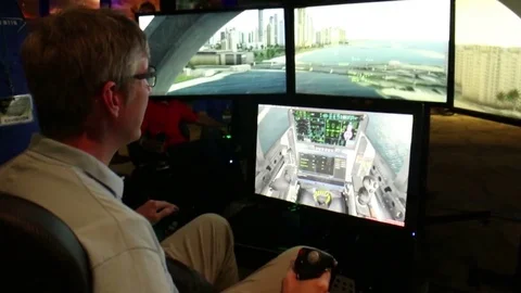 A man uses a VR military simulator at a Virtual Reality exhibition Stock Footage 72492495