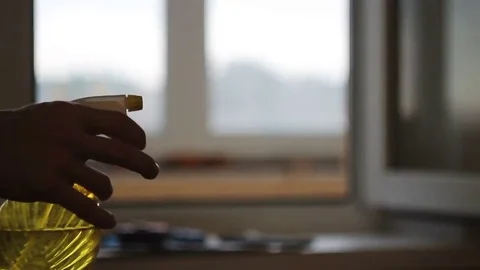Man uses yellow sprayer 스톡 동영상 69214597