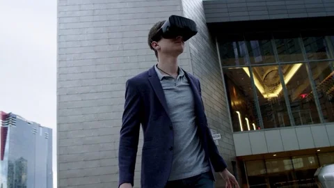 Man using 3d viewer outdoor in the city Stock Footage 73749526