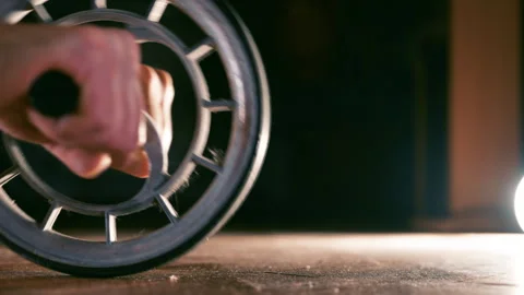 Man Using Ab Roller Wheel Exercising Core Muscles on Gym Floor | Hands Rolling Stock Footage 331174448