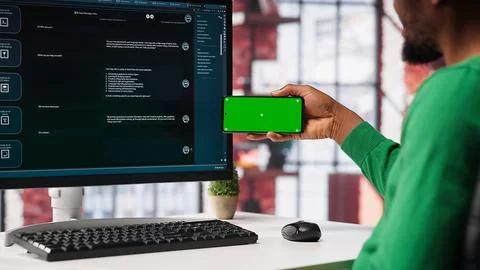 Man using AI chatbot to generate real time responses next to mockup display Foto stock