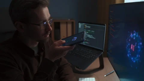 Man using AI Voice Assistant and artificial intelligence agent on phone and pc Stock Footage 341680761