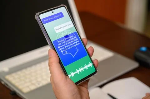 A man using AI voice services on a mobile device. artificial intelligence c.. Foto stock
