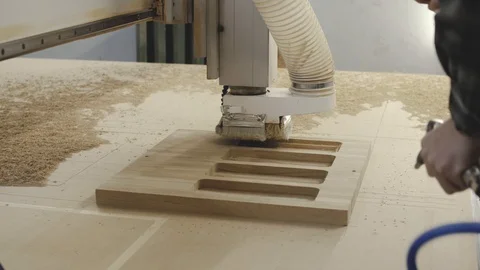 Man using air compressor system to blow sawdust, slow motion Video stock 105008827