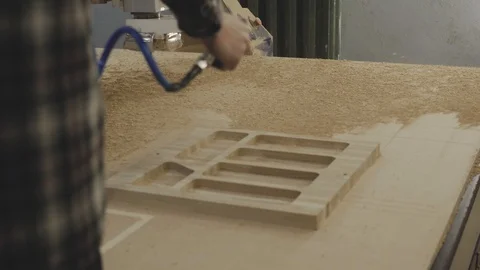 Man using air compressor system to blow sawdust, slow motion Vídeo Stock 105044797
