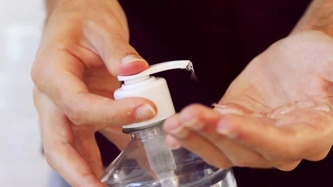 Man using alcohol gel for hand hygiene. Hygiene concept. Covid-19. Stock Footage 133599992