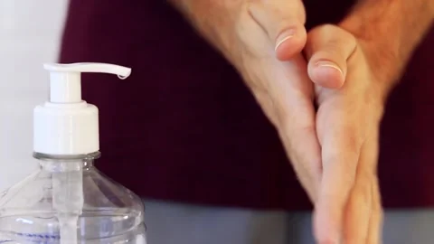 Man using alcohol gel for hand hygiene. Hygiene concept. Covid-19. Stock Footage 133599995