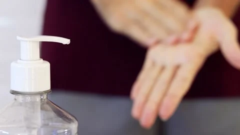 Man using alcohol gel for hand hygiene. Hygiene concept. Covid-19. Stock Footage 133600001