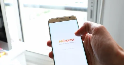 Man Using Aliexpress App With His Modern Smartphone Stock Footage 98486133