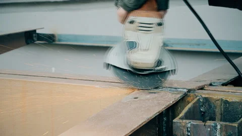 Man using angle disc grinder, sparks while grinding iron Video stock 106165492