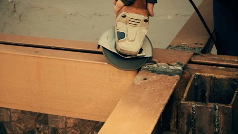 Man using angle disc grinder, sparks while grinding iron Stock Footage 106324090