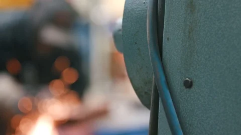 Man Using Angle Grinder - Bokeh and focus pull Stock Footage 103774375