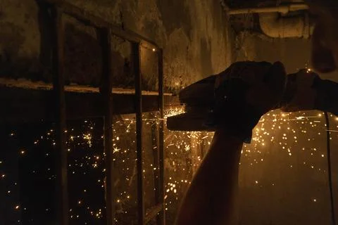 A man using angle grinder Fotos Stock